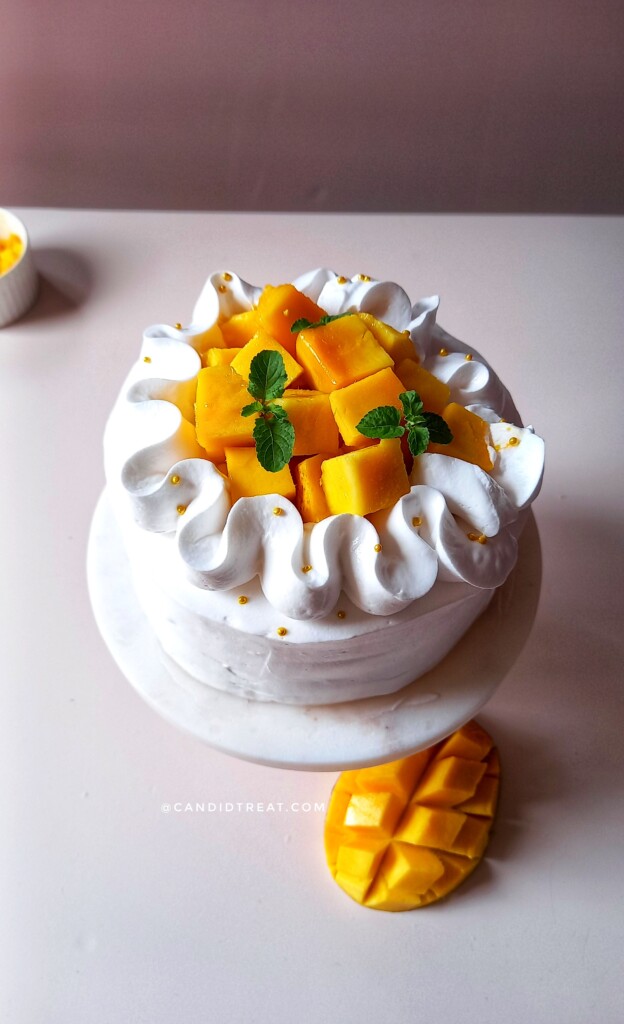 Light & Fluffy Mango Cake | icing, mango, cake, whipped cream, recipe |  Recipe: https://tatyanaseverydayfood.com/mango-cake/ Creamy mango cake with  sponge cake layers, mango puree and the fluffiest mango whipped cream  frosting!! |